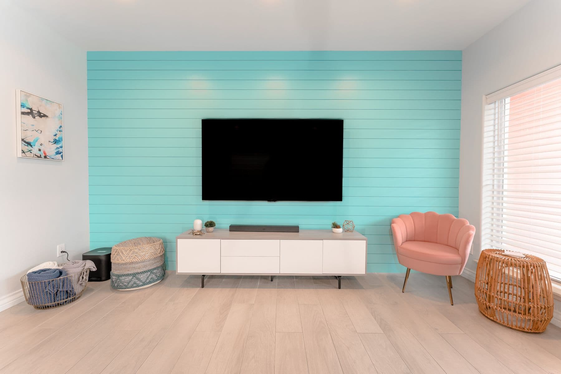 Turquoise media wall with 75-inch TV