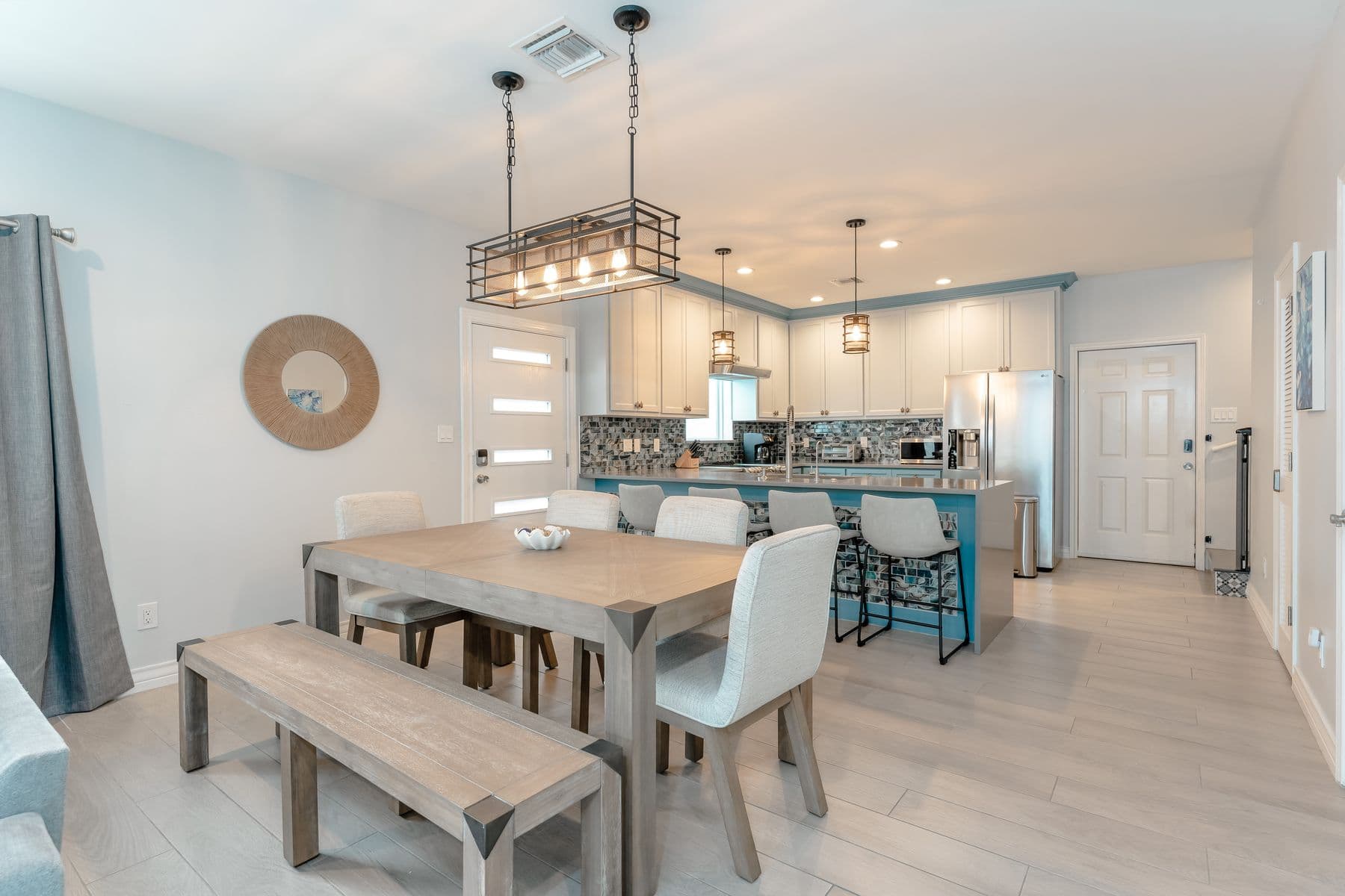 Dining table with bench seating beside the kitchen