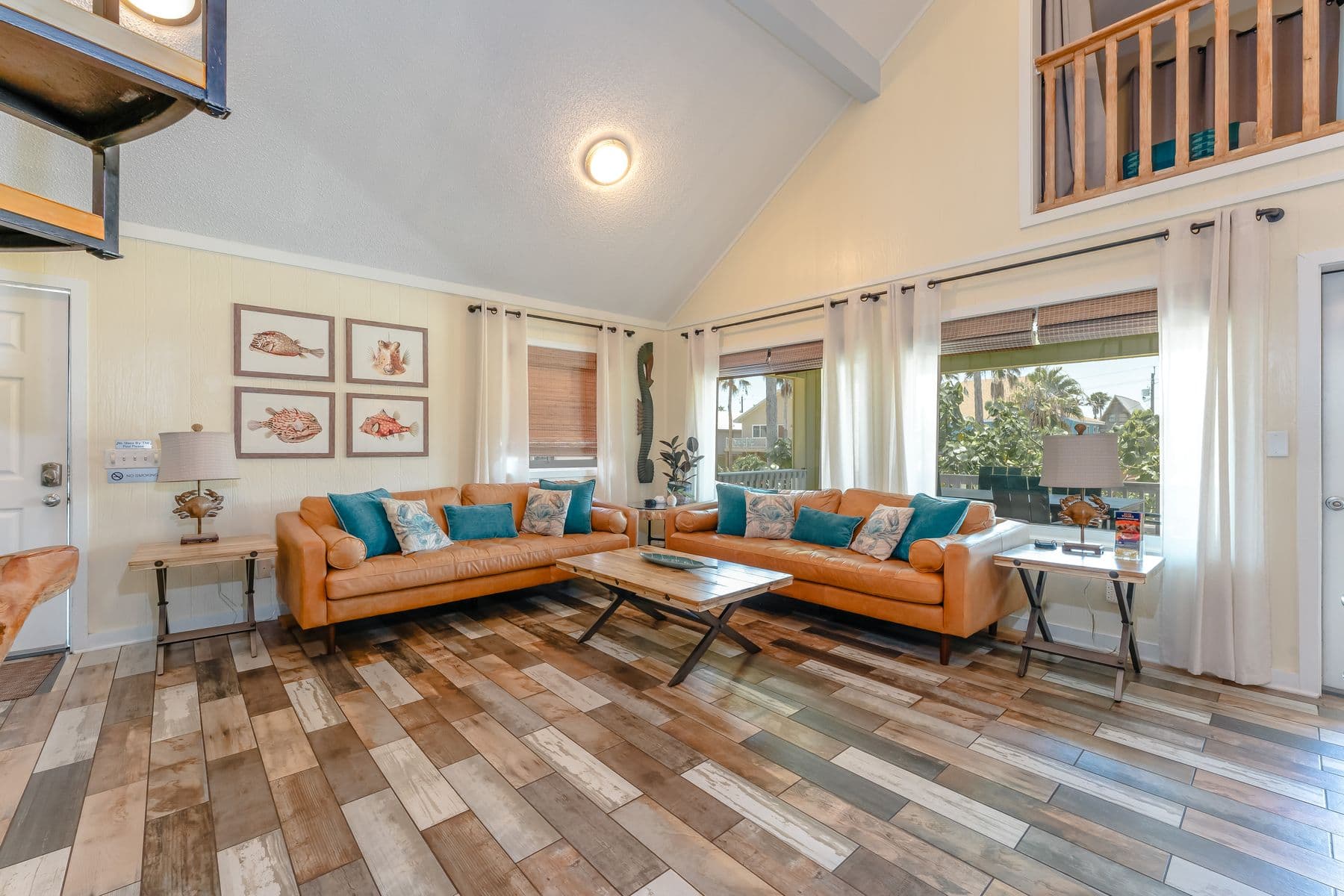 Living room under the vaulted ceiling with loft above