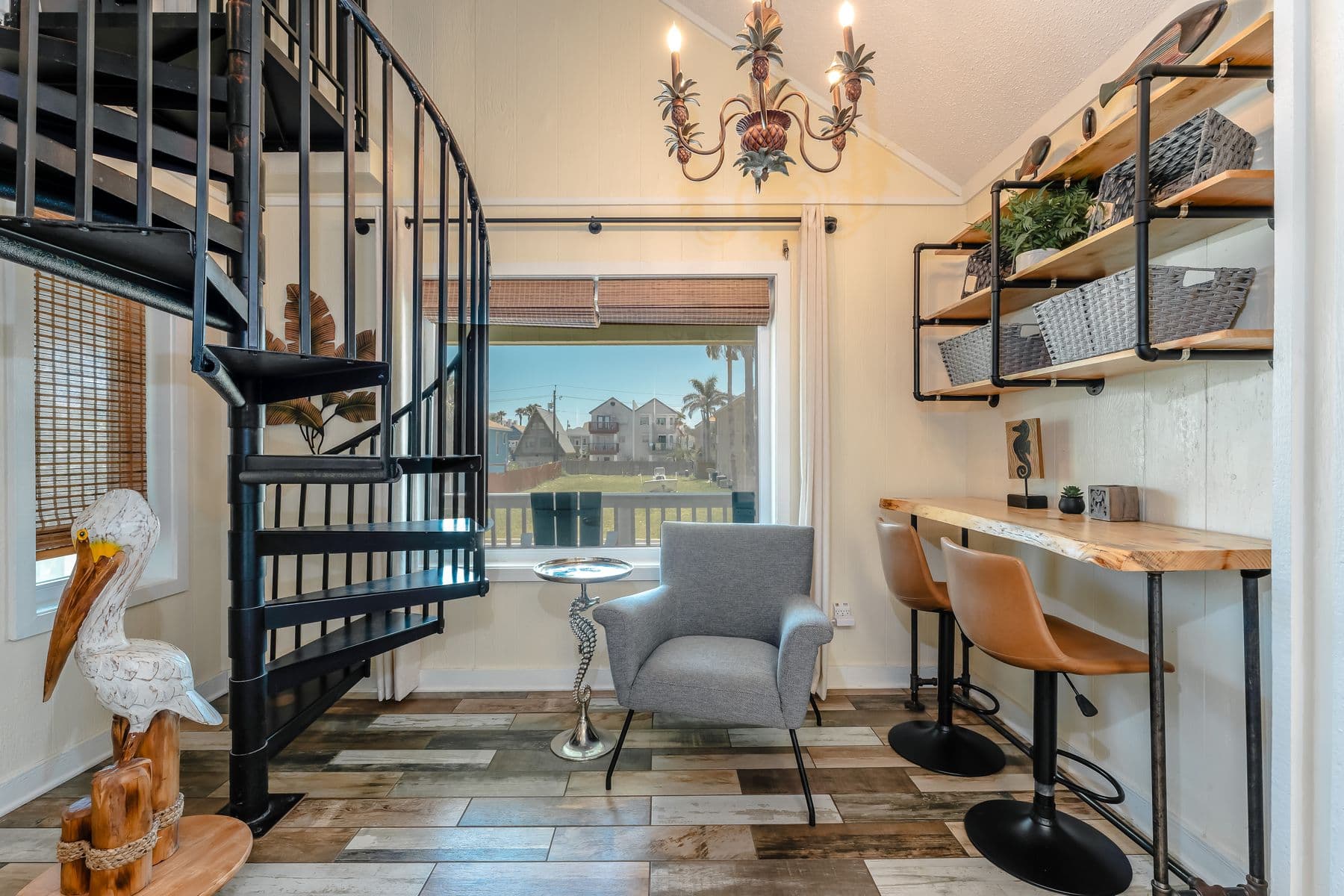 Work nook with desk and stools by the window
