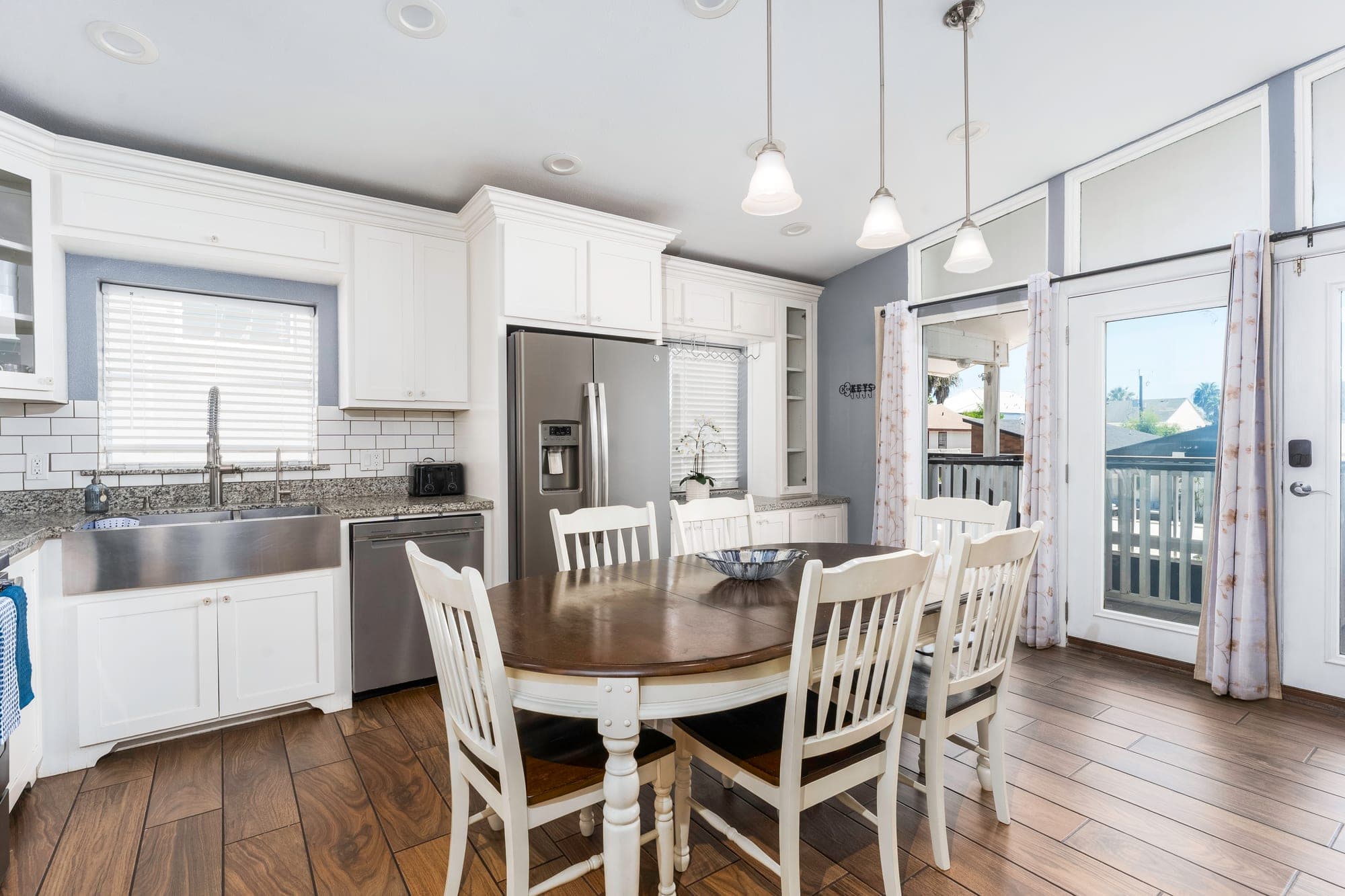 Updated kitchen with farmhouse sink and dining for six